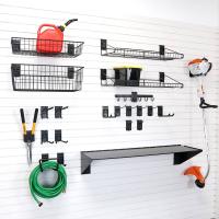 Garage shovel storage and rake rack with slatwall accessories.