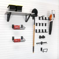 Garage tool storage with garden hose hooks and shovel rack