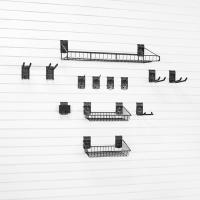 Rake and shovel storage solution on slatwall panels