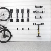 Multiple mountain bikes stored on Steadyrack racks in a garage
